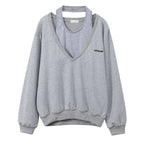 Niche Women's Grey V-neck Sweater with Unique Design