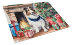 Sheltie Cozy Christmas Glass Cutting Board