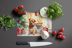 Norfolk Terrier Cozy Christmas Glass Cutting Board
